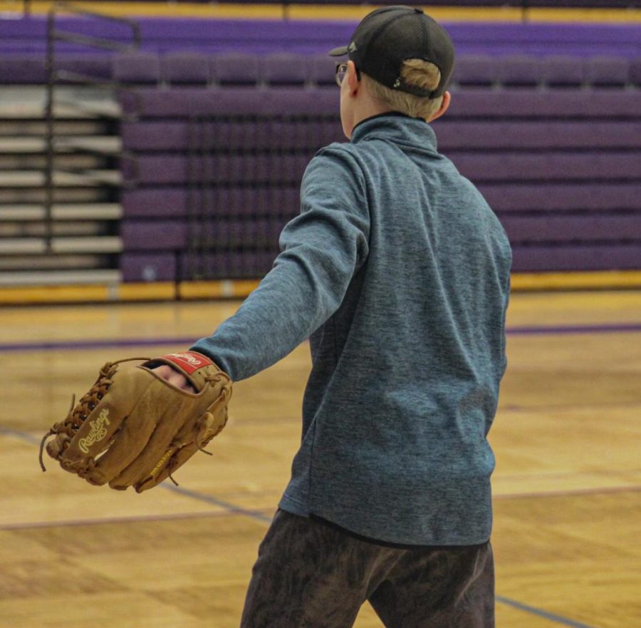 Freshman Tyler Schartz tries out for the baseball team for the first time. Schartz practiced by himself for three days before tryouts started. He said, "Baseball effects my life in a big way. You get to see your friends, and go do something you like for your school." 