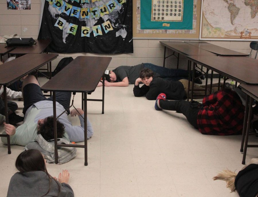 After being hit, the students lay "dead" in no man's land. The only way to move them is to slide them. Feb. 8, 2023. 